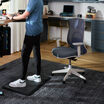 vari ascent chair in steel blue in home office setting with professional sitting